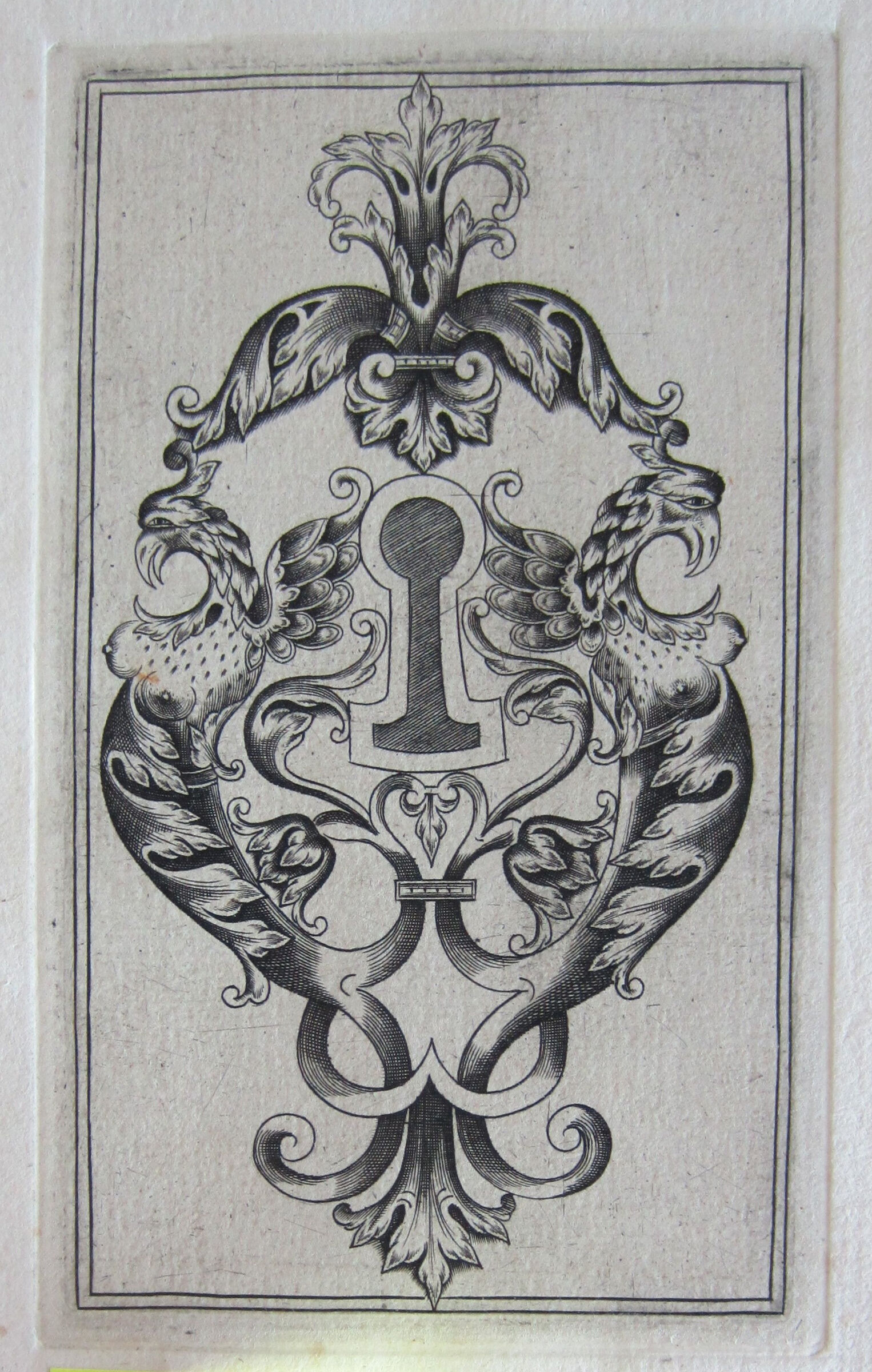 Escutcheon With A Shaded Keyhole Flanked By Two Monstrous Dappled Eagles With Breasts