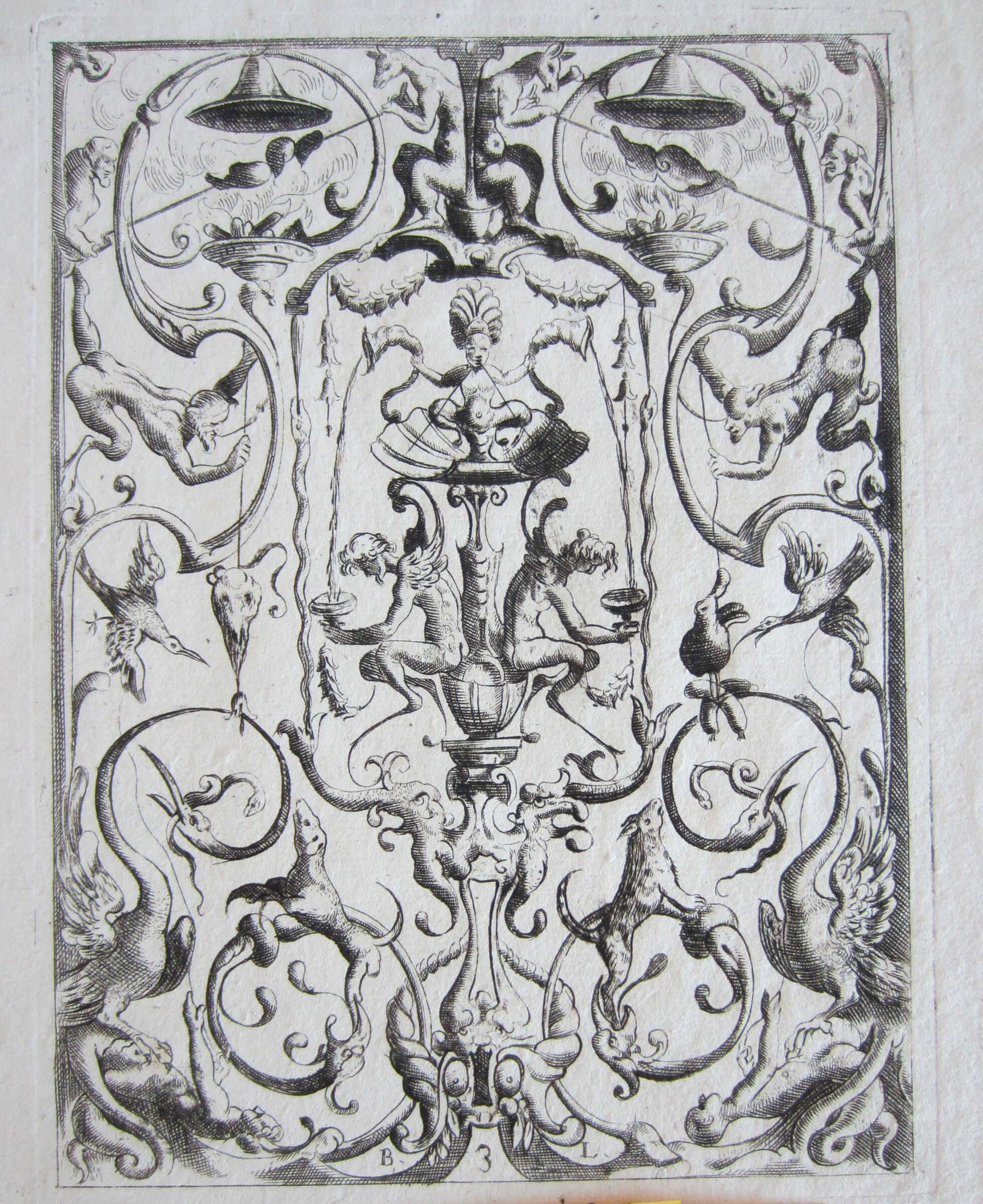 Grotesque With A Figure Seated In A Shell  Pouring Liquid Into Tazze Held By Two Winged Figures