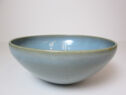 A curved light blue bowl.