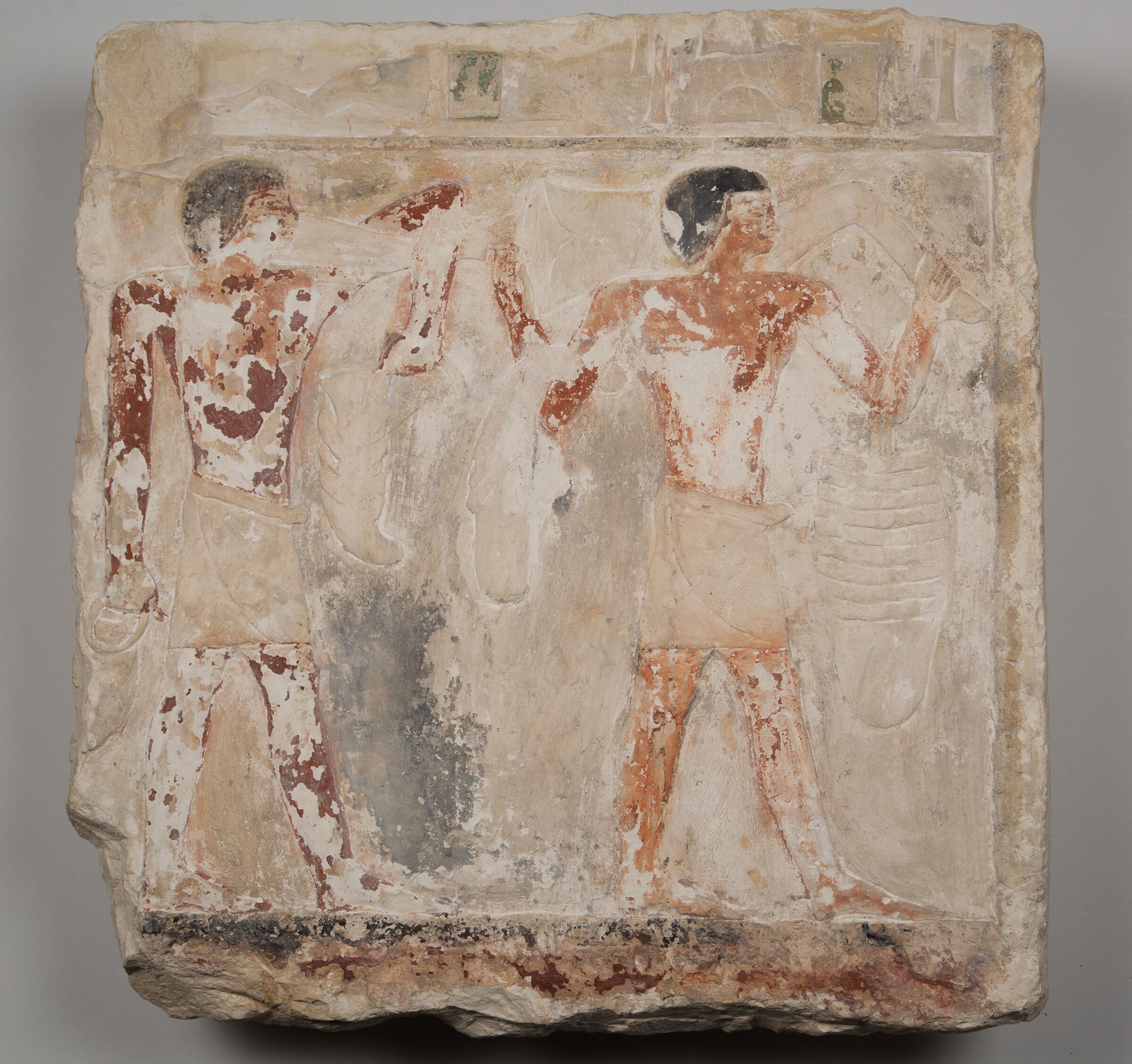 Relief Fragment From The Tomb Of Niankhnesut: Two Attendants Carrying Meat