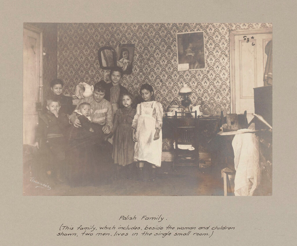 Social Settlements: United States. Pennsylvania. Philadelphia. The College Settlement: Environment After Immigration. Perpetuation Of European Standards In America. The College Settlement, Philadelphia, Pa.: Polish Family. (This Family, Which Includes, Beside The Woman And Children Shown, Two Men, Lives In The Single Small Room.)