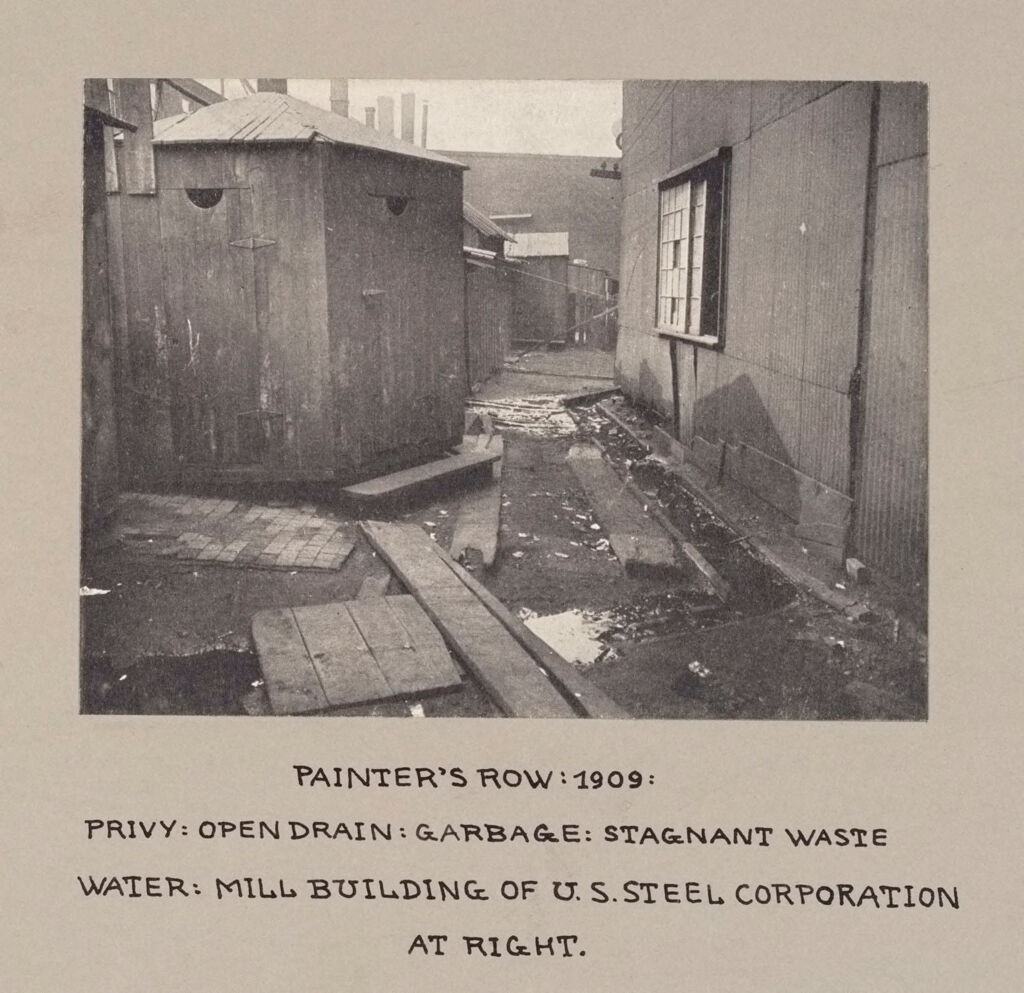Housing, Conditions: United States. Pennsylvannia. Pittsburgh. Houses; Streets; Yards: Housing Conditions, Pittsburgh, Pa.: Painter's Row: 1909: Privy: Open Drain: Garbage: Stagnant Waste Water.