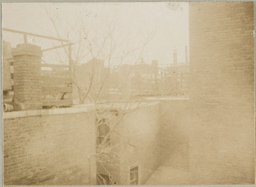 Housing, Conditions: United States. Massachusetts. Boston. Alleys; Tenements; Yards: Housing Conditions: Boston: Views From Roofs Of Poplar St. Block Showing Unkempt Fences Shed & Litter Not Suggested By The Model.: From 89 Poplar St: Looking So.e. Toward Milton St: 1911.