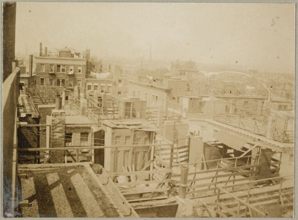 Housing, Conditions: United States. Massachusetts. Boston. Alleys; Tenements; Yards: Housing Conditions: Boston: Views From Roofs Of Poplar St. Block Showing Unkempt Fences Shed & Litter Not Suggested By The Model.: From 65 Poplar St: Looking N.e. Toward Brighton St: 1911.