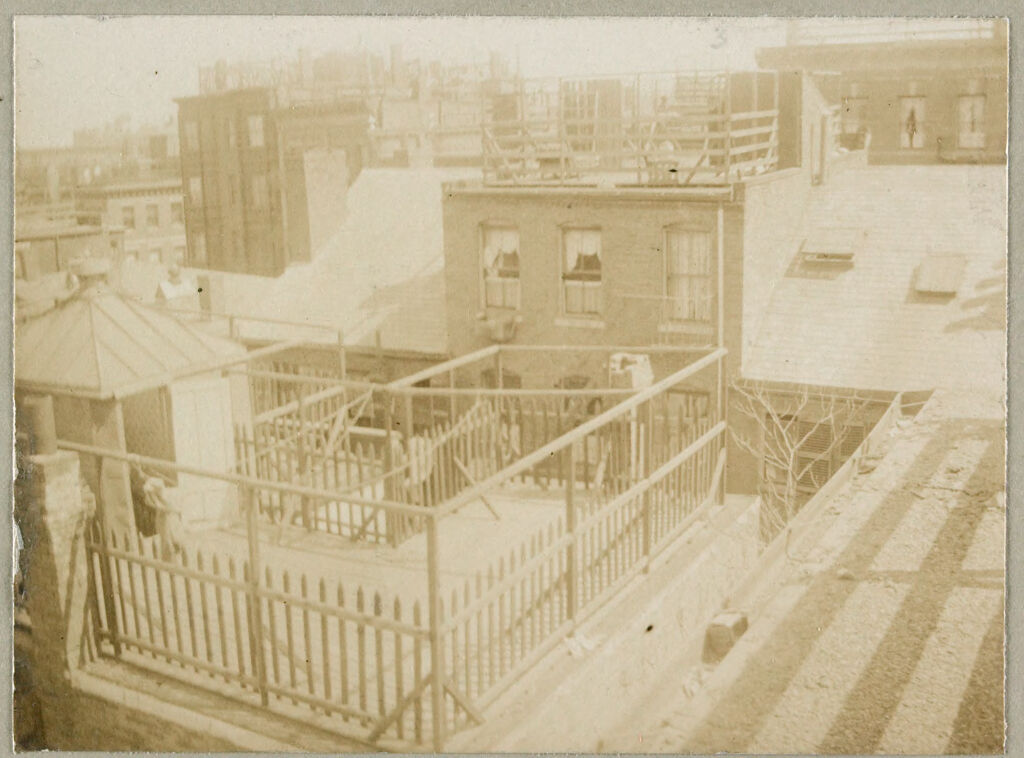 Housing, Conditions: United States. Massachusetts. Boston. Alleys; Tenements; Yards: Housing Conditions: Boston: Views From Roofs Of Poplar St. Block Showing Unkempt Fences Shed & Litter Not Suggested By The Model.: From 65 Poplar St: Looking So. Toward Spring St: 1911.