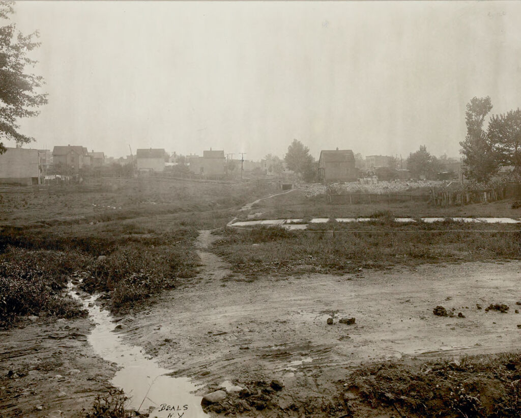 Housing, Conditions: United States. New Jersey. Newark: Housing Conditions In Newark, New Jersey: The Health And Safety Of The Inhabitants Of A Municipality May Be Menaced By Laxness Of Neighboring Communities. The Photograph At The Right Shows An Open Sewer And Dump At The City Line Menacing The Health Of The Inhabitants Of Two Municipalities.