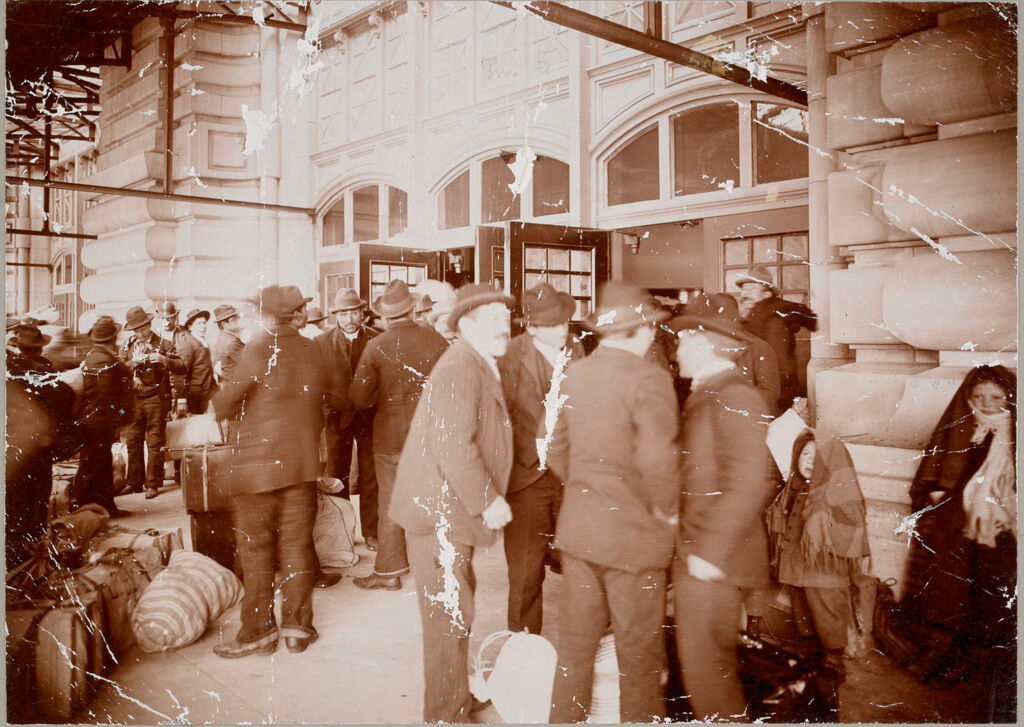 Races, Immigration: United States. New York. New York City. Immigrant Station: Regulation Of Immigration At The Port Of Entry. United States Immigrant Station, New York City: Under Canopy, Waiting To Enter Main Entrance To Hall.