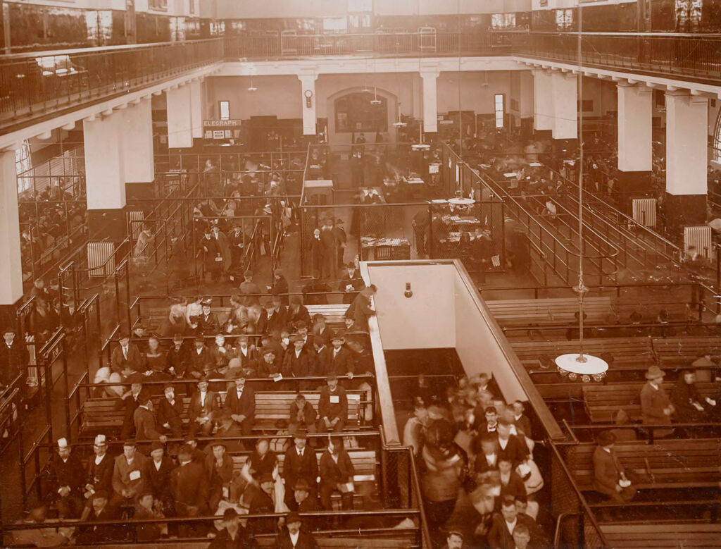 Races, Immigration: United States. New York. New York City. Immigrant Station: Regulation Of Immigration At The Port Of Entry. United States Immigrant Station, New York City: View Of Main Floor. Immigrants Awaiting Further Inspection.