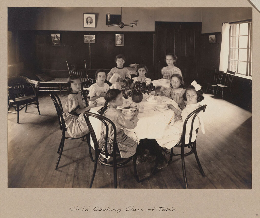 Social Settlements: United States. Massachusetts. Boston. South End House: South End House, Boston, Mass.: Vacation School 1907.: Girls' Cooking Class At Table.