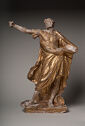 Gilded statue of a man with his right arm extended