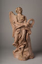 Terracotta statue of winged angel holding a crown.