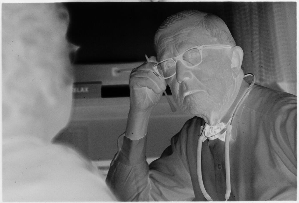 Untitled (Dr. Herman M. Juergens Talking With Patient In Exam Room)