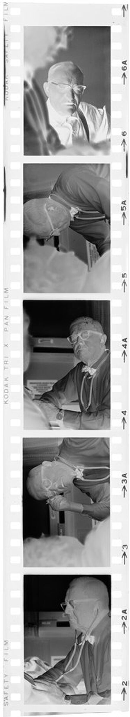 Untitled (Dr. Herman M. Juergens Talking With Patients In Exam Room)