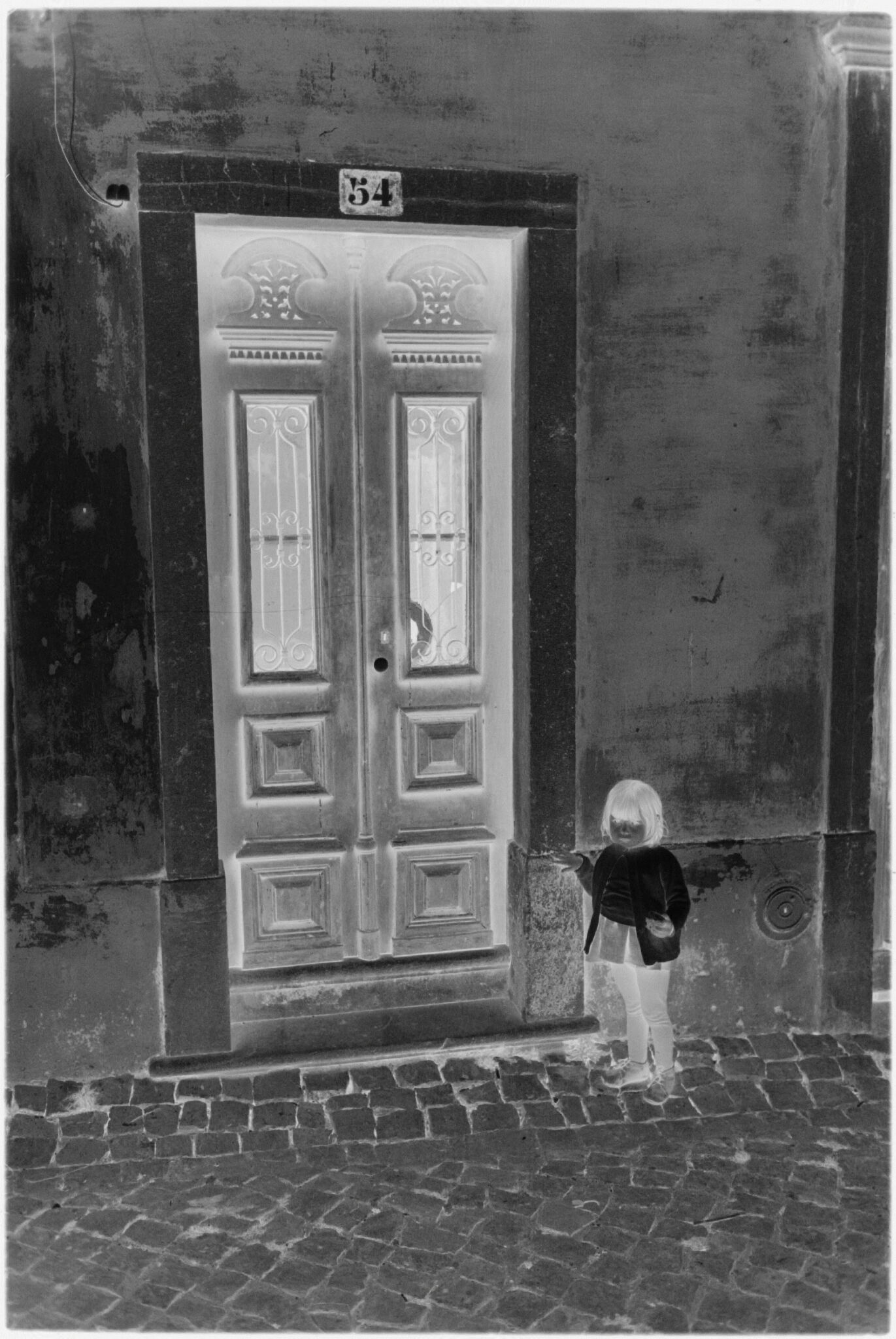 Untitled (Child Standing In Street Next To Doorway, Nazaré, Portugal)