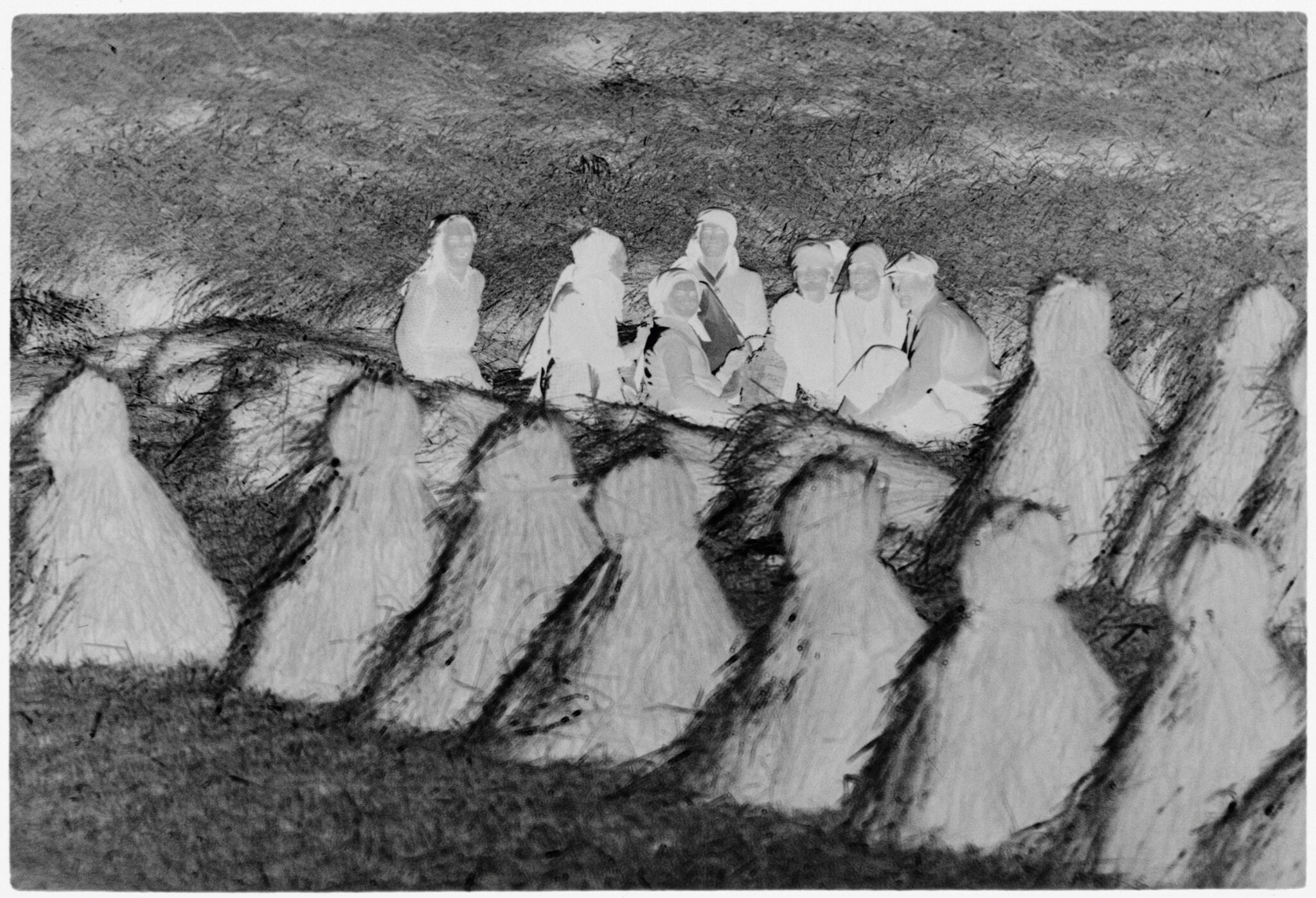 Untitled (Group Of Women Sitting By Rows Of Haystacks, Nazaré, Portugal)