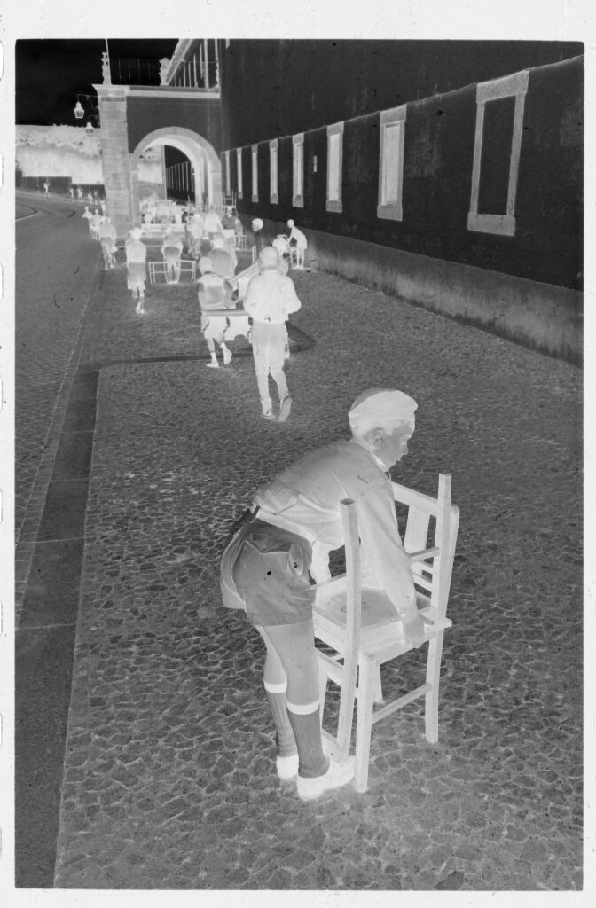 Untitled (Children Carrying Chairs Through Town Square, Nazaré, Portugal)