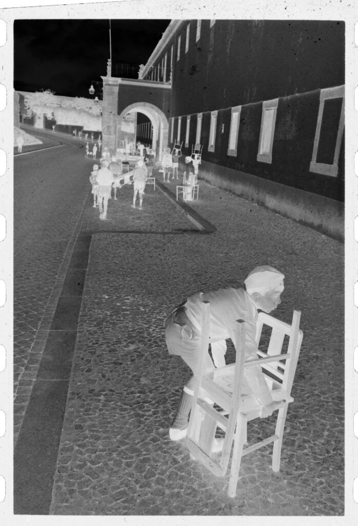 Untitled (Children Carrying Chairs Through Town Square, Nazaré, Portugal)