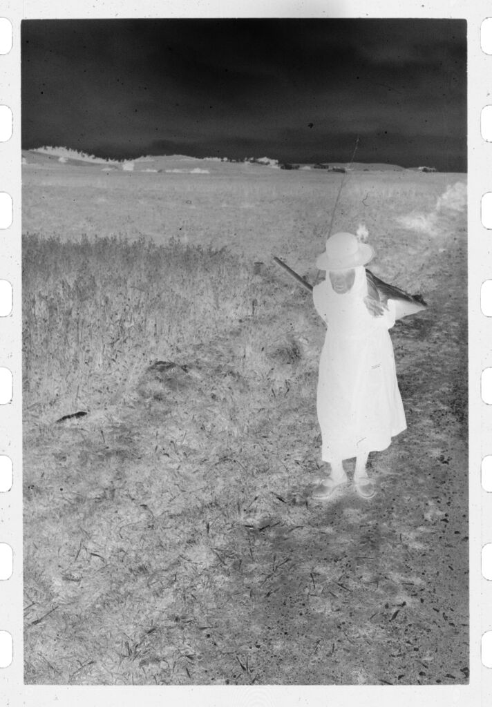 Untitled (Woman Carrying Scythe And Pack Along Road By Field, Nazaré, Portugal)