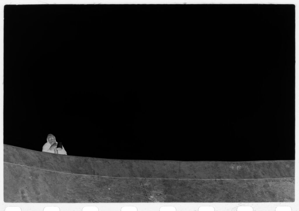 Untitled (Figure Looking Out Over High Wall, Nazaré, Portugal)