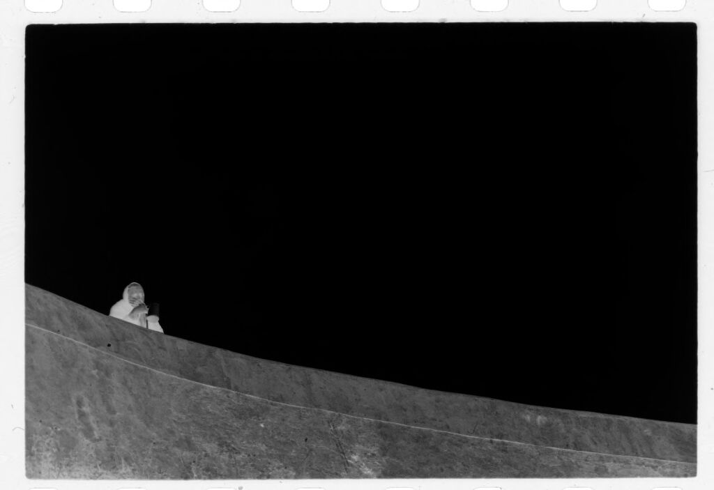 Untitled (Figure Looking Out Over High Wall, Nazaré, Portugal)