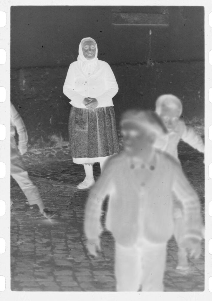 Untitled (Old Woman And Young Boys In Cobblestone Street, Nazaré, Portugal)
