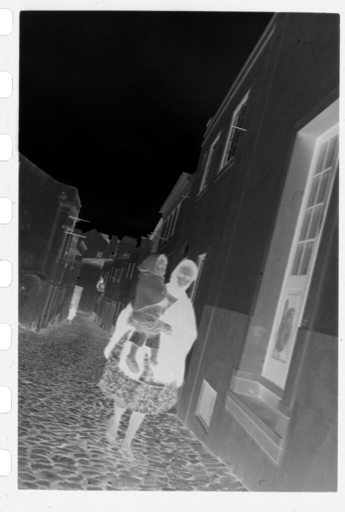 Untitled (Woman Carrying Child Walking Down Street, Nazaré, Portugal)