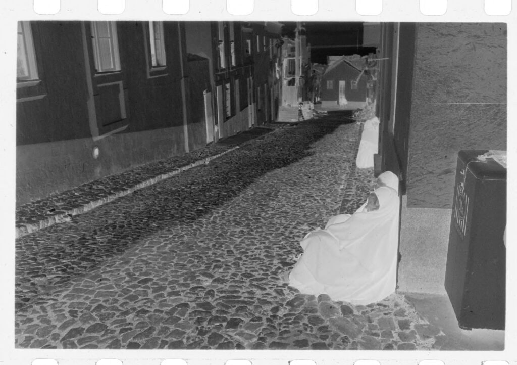 Untitled (Women Seated In Street Leaning Against Buildings, Nazaré, Portugal)