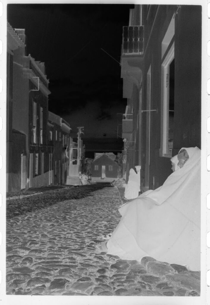 Untitled (Women Seated In Street Leaning Against Buildings, Nazaré, Portugal)