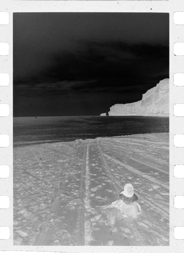 Untitled (Young Girl Crouching On Beach, Nazaré, Portugal)