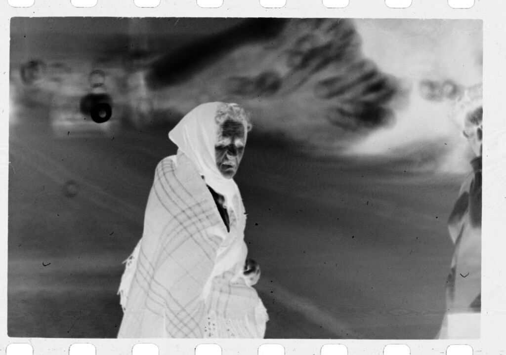 Untitled (Woman Wrapped In Shawl And Headscarf On Side Of Road, Nazaré, Portugal)