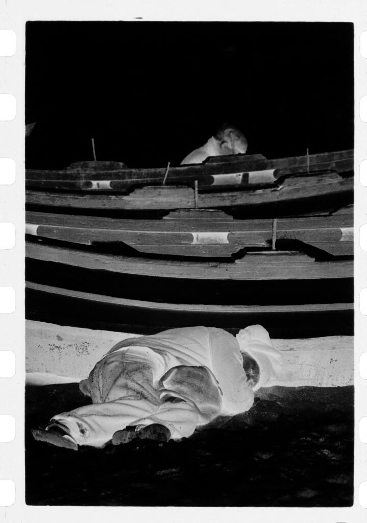 Untitled (Fisherman Lying On Beach Next To Fishing Boat, Nazaré, Portugal)