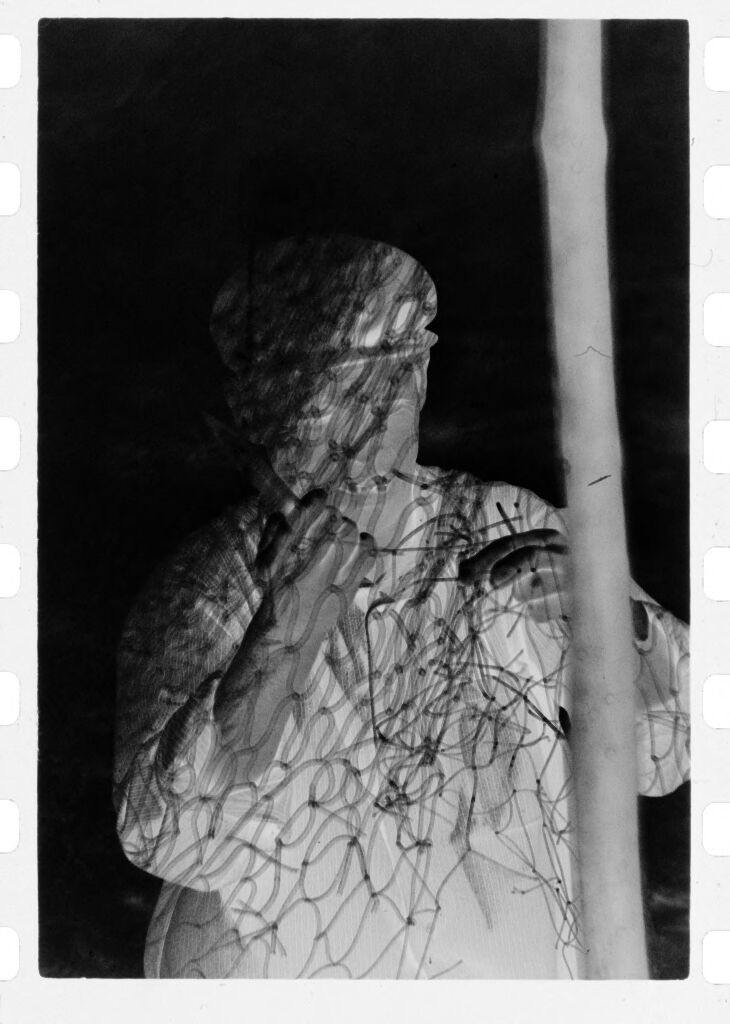 Untitled (Fisherman Covered In Fishing Net, Nazaré, Portugal)