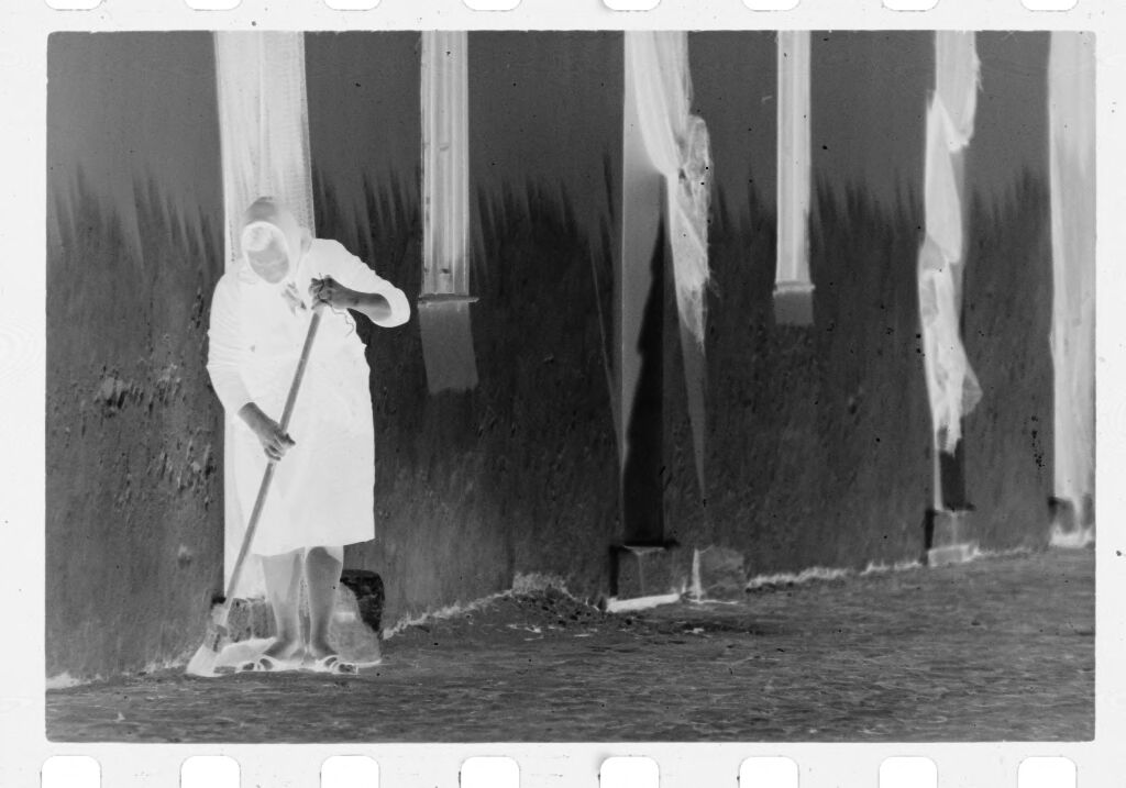 Untitled (Woman Sweeping Street In Front Of Building, Nazaré, Portugal)