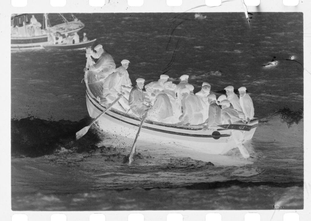 Untitled (Men Rowing Fishing Boat Over Waves, Nazaré, Portugal)