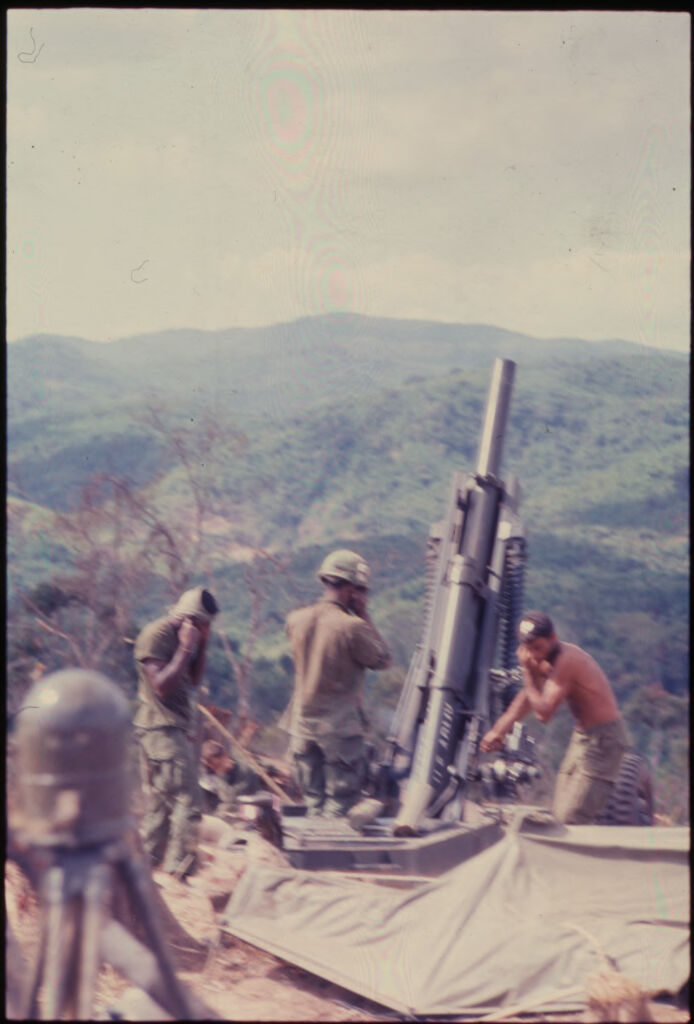 Untitled (Three Soldiers On Cliff Setting Up Rocket Launcher/Recoilless Rifle, Vietnam)