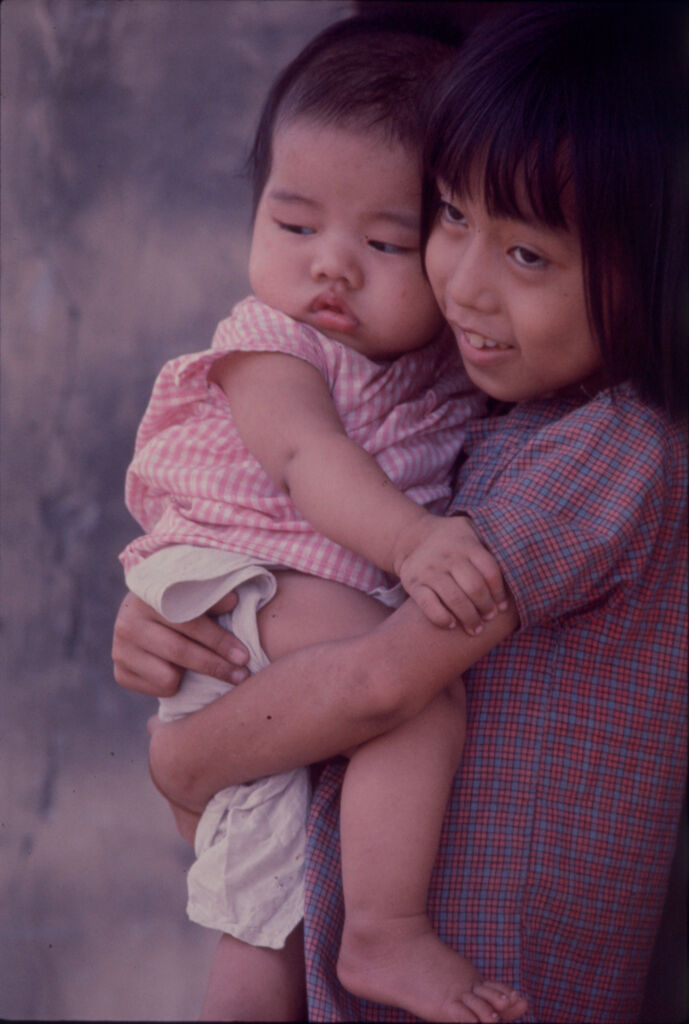 Untitled (Young Girl Holding Baby, Hue, Vietnam)