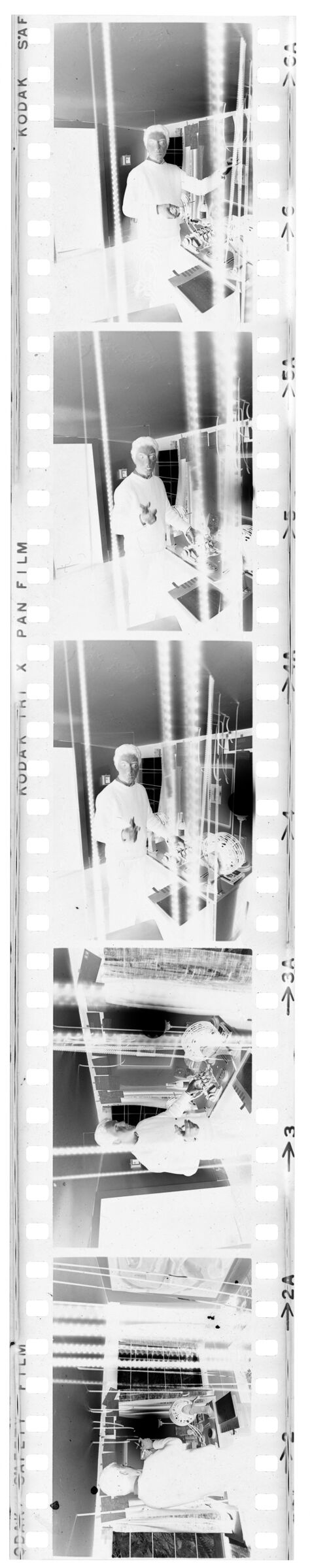 Untitled (Photographer Cutting And Hanging Film)