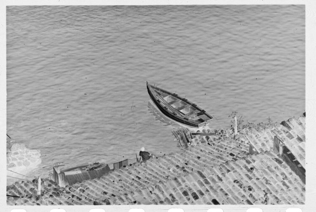 Untitled (Aerial View Of Rowboat On Water)