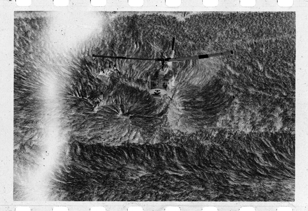 Untitled (Aerial View Of Helicopter Landing In Field, Vietnam)