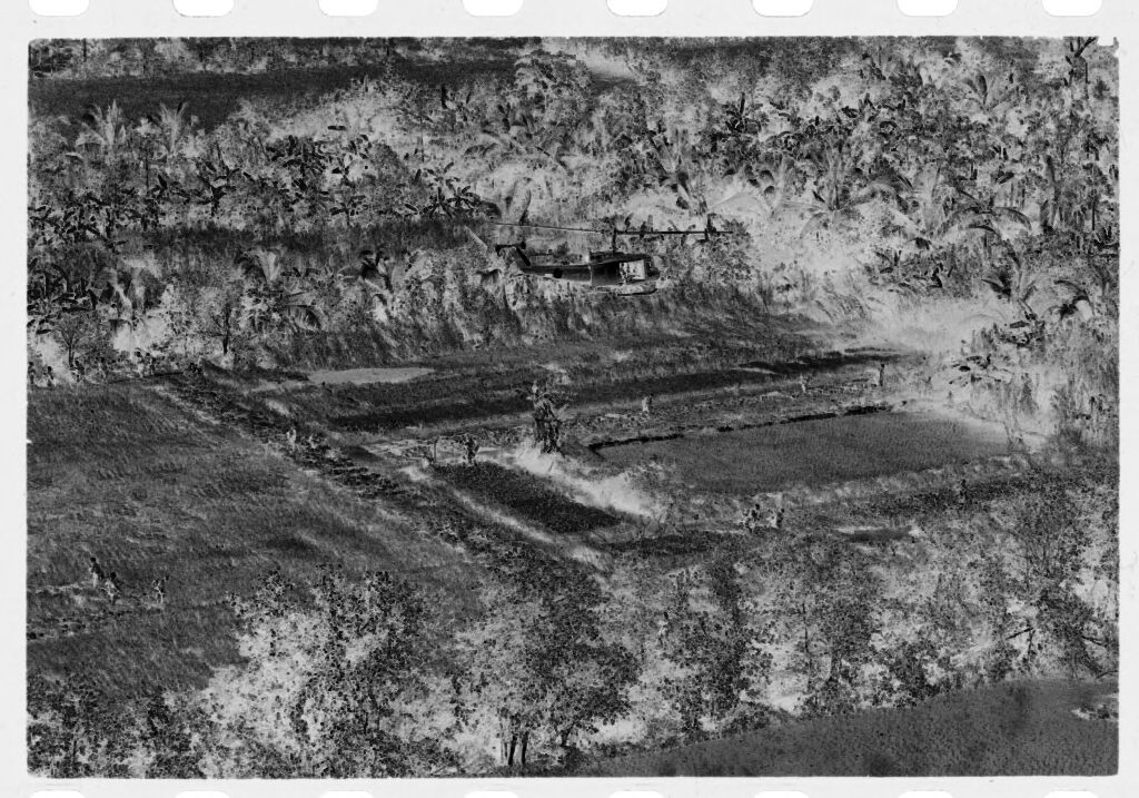 Untitled (Helicopters Flying Over Open Field And Paddies, Vietnam)