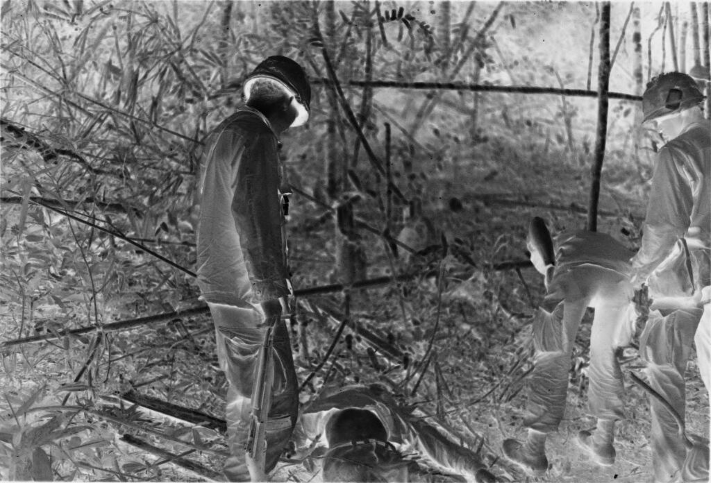 Untitled (American Soldiers Examining Dead North Vietnamese Soldier, Vietnam