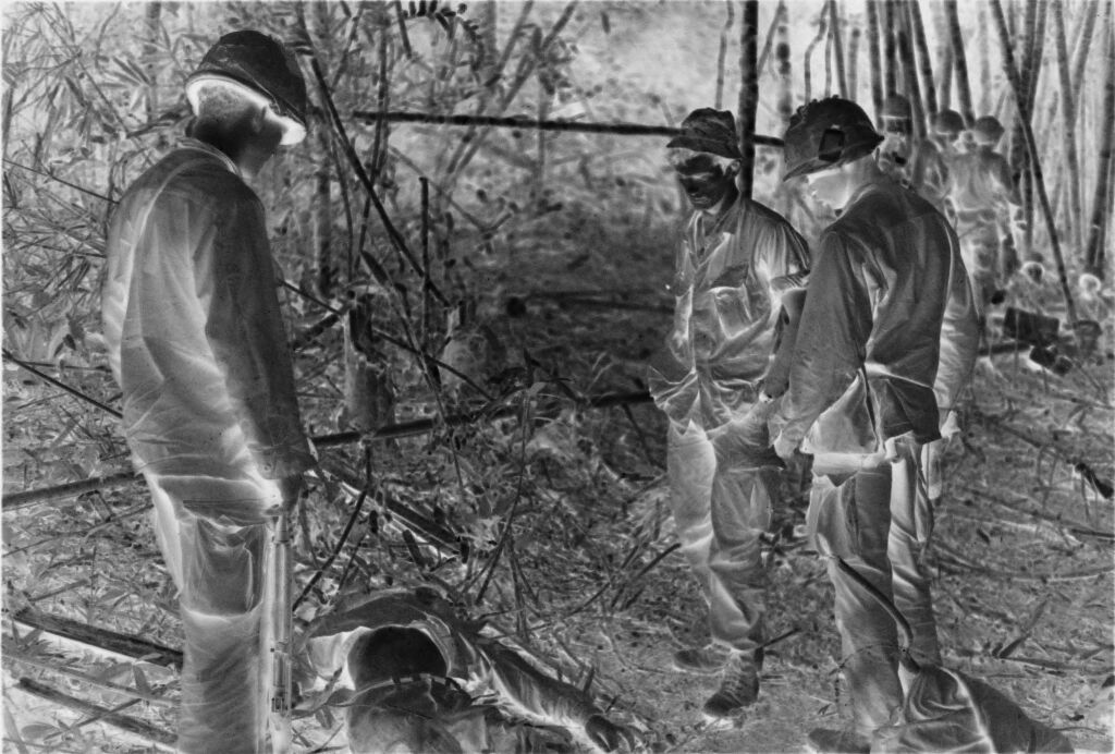 Untitled (American Soldiers Examining Dead North Vietnamese Soldier, Vietnam)