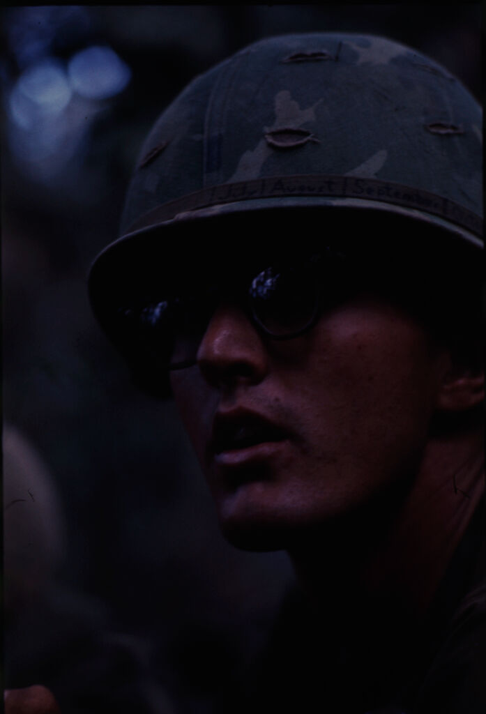 Untitled (Soldier In Camouflage Helmet And Sunglasses, Central Highlands Near Dak To, Vietnam)