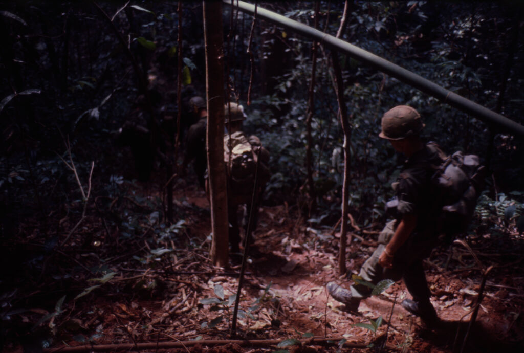 Untitled (Soldiers Walking Through Jungle Of Central Highlands Near Dak To, Vietnam)