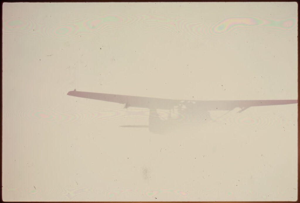 Untitled (Army Plane Flying In Foggy Sky, Vietnam)