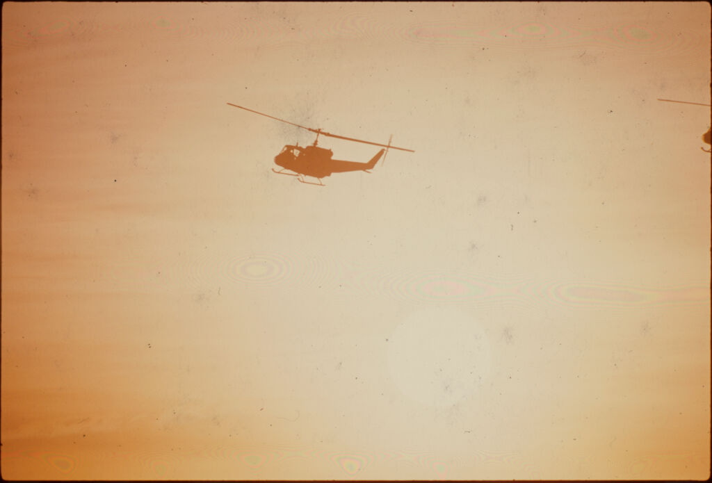 Untitled (Helicopter Flying Against Setting Sun, Vietnam)
