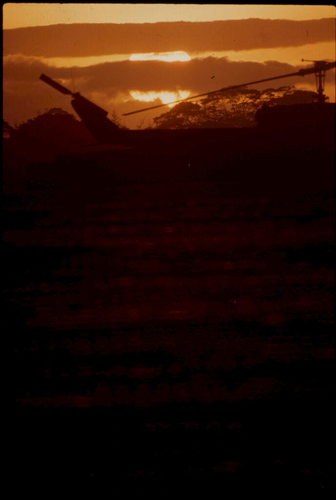 Untitled (Helicopters Silhouetted Against Setting Sun And Clouds, Vietnam)