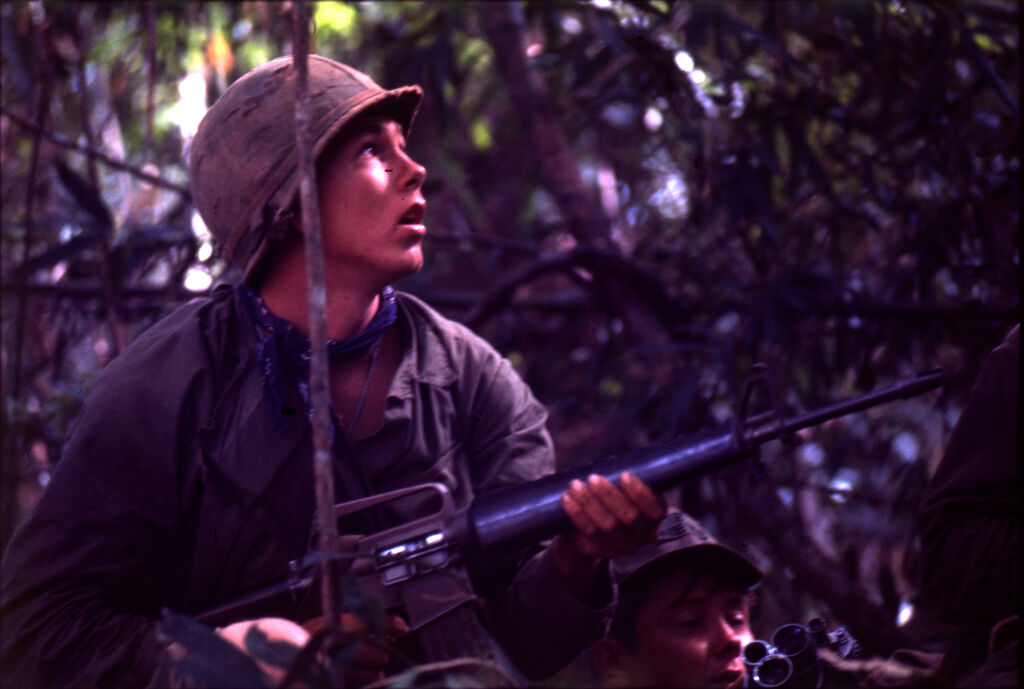 Untitled (Soldier Looking Into Trees During Fighting In Central Highlands Near Dak To, Vietnam)