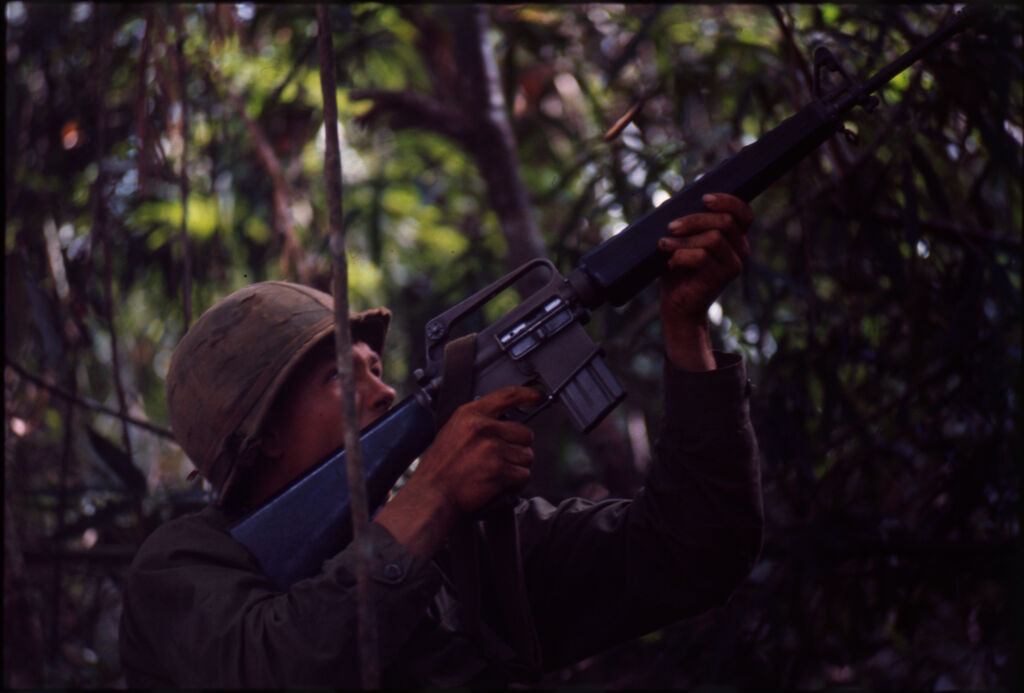 Untitled (Soldiers Aiming Guns Into Trees During Fighting In Central Highlands Near Dak To, Vietnam)