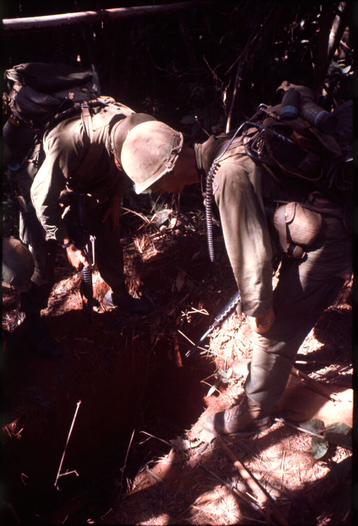 Untitled (Soldiers Examining Bunker Found In Jungle, Central Highlands Near Dak To, Vietnam)